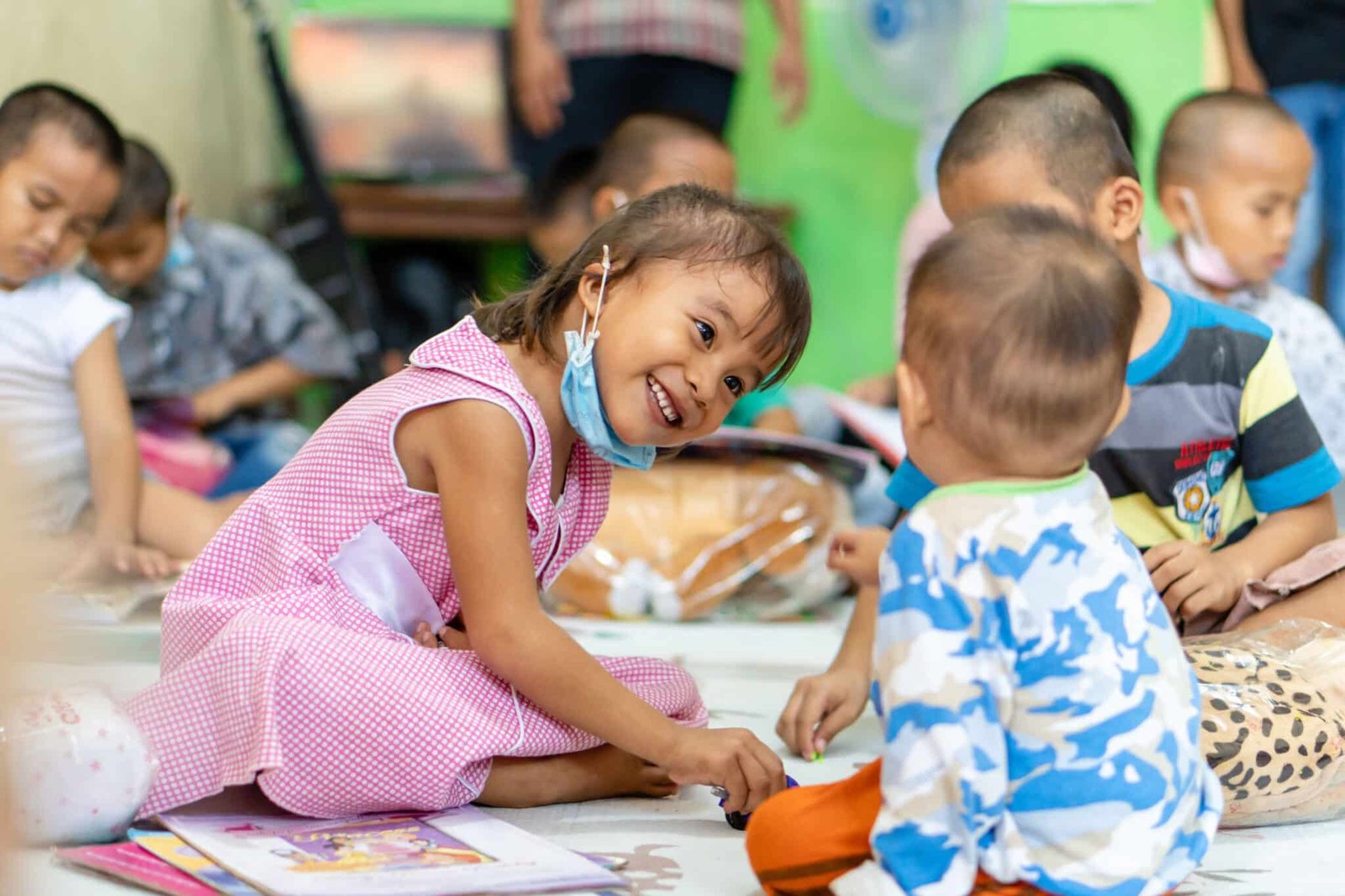 Teacher communicating with child